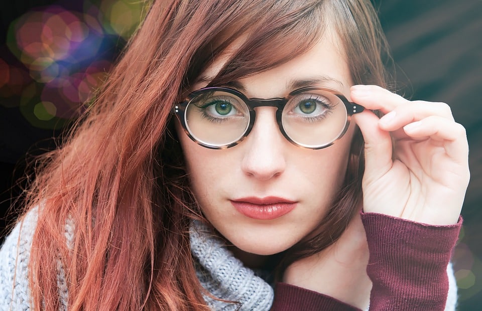 Serious woman wearing trendy glasses