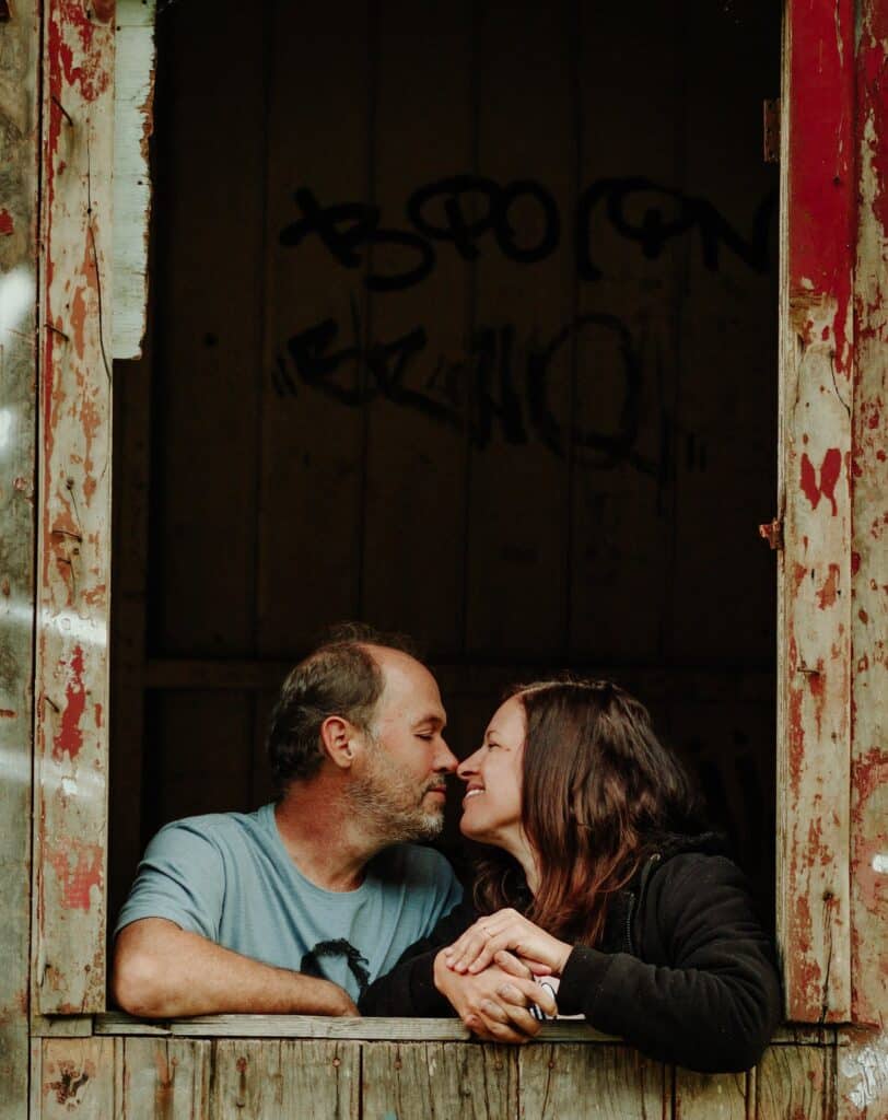Happy, loving couple in a barn