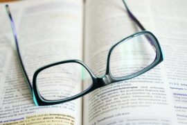 reading glasses over an open book